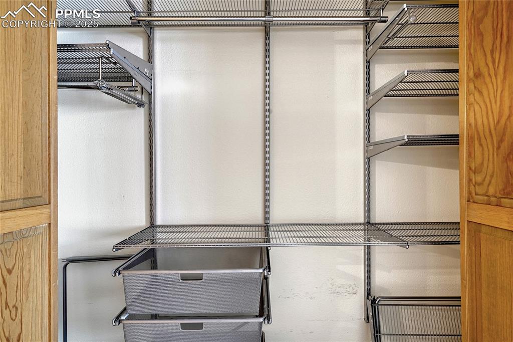 Two Walk-in Closets, One with Elfa Shelving