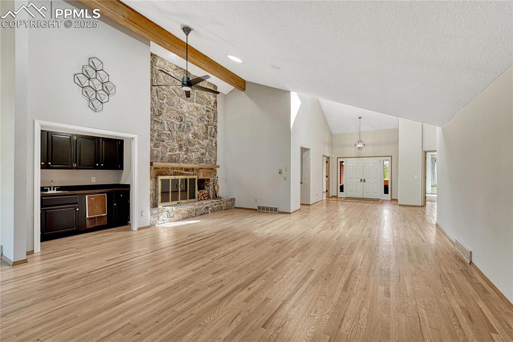 Vaulted with Wood Beam, Hardwood Floors, Wet Bar