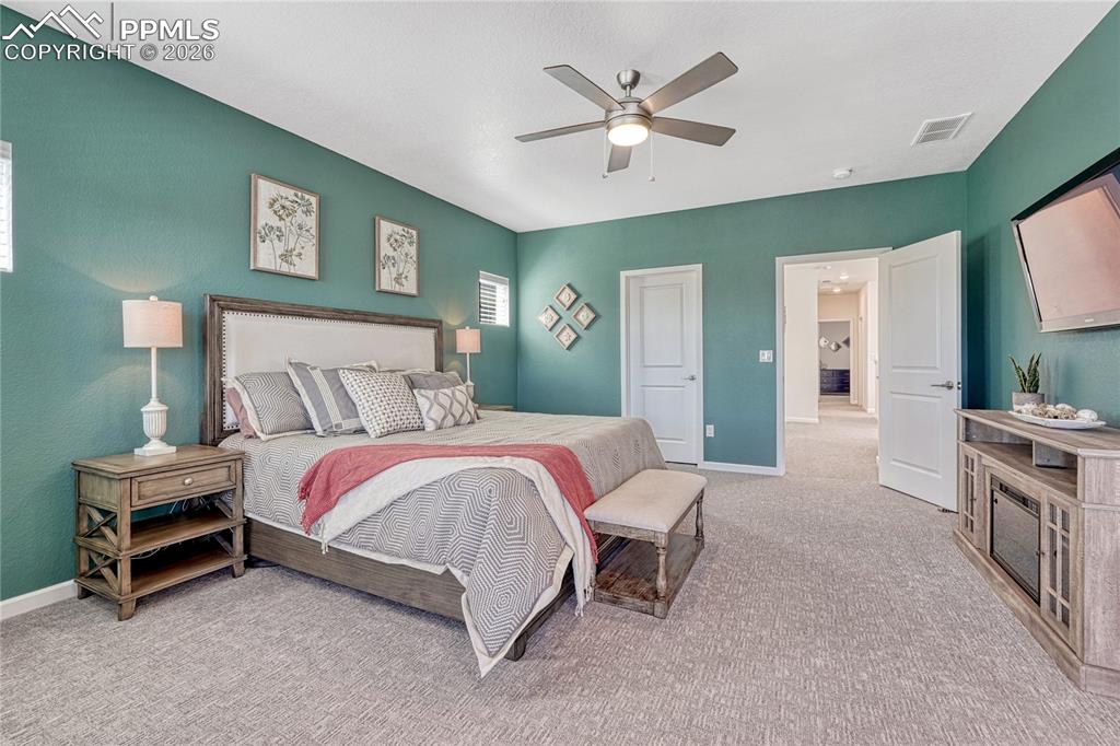 The large master bedroom can fit more than a king-sized bed, has an adjoining bathroom and separate closet spaces
