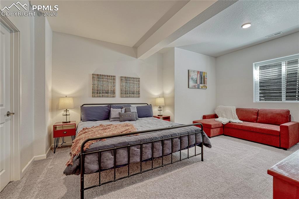 Off the large family room is a over-sized bedroom with space for a sitting area and also offers a walk-in closet
