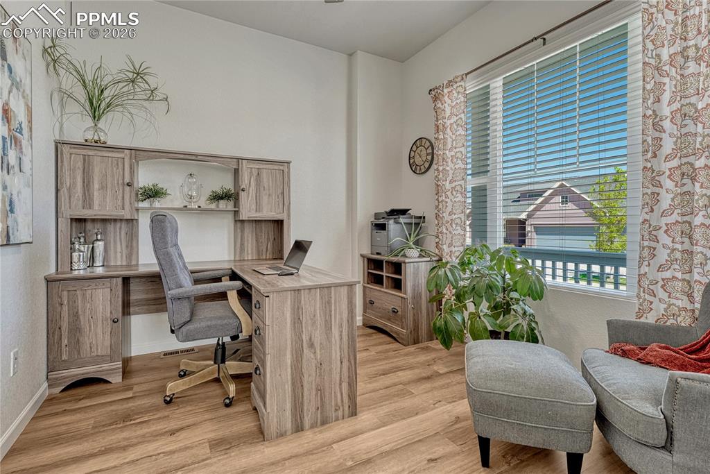 Off the entry is a home office space overlooking the front with its large window
