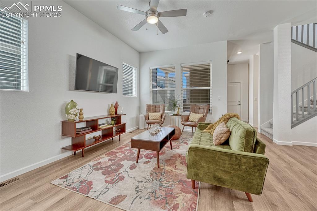 The living room connects the dining space and kitchen on the main level
