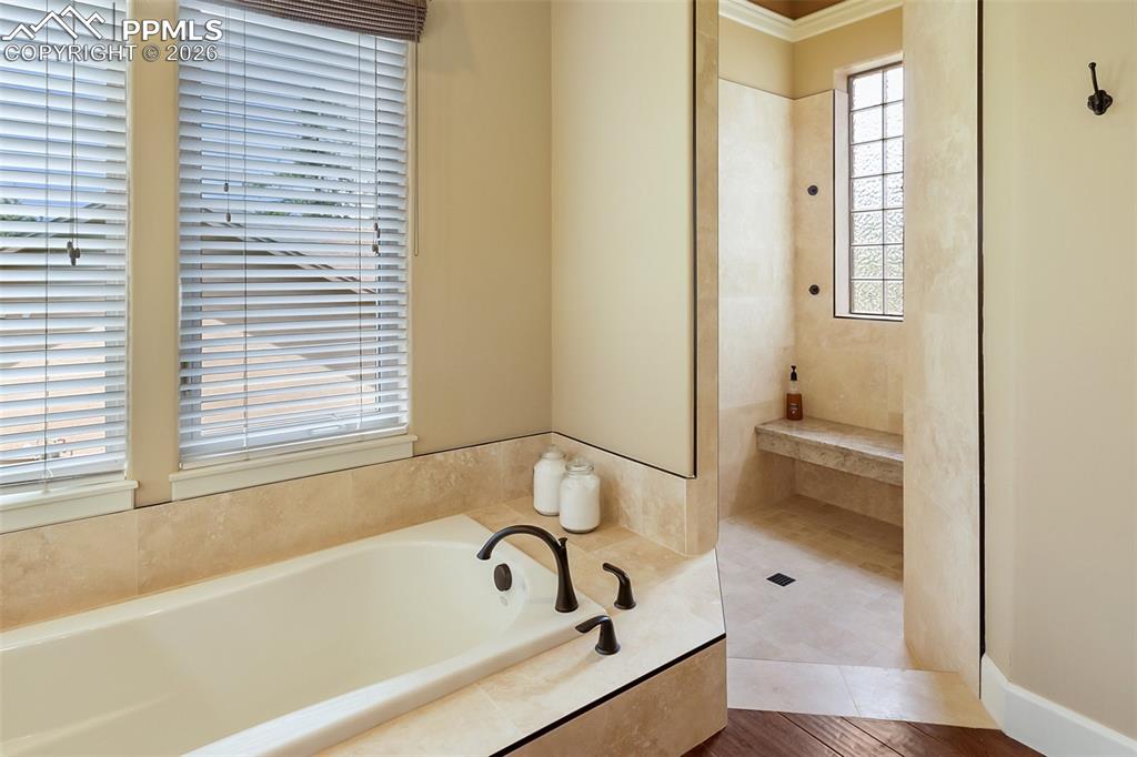 Primary suite soaking tub with radiant heat above