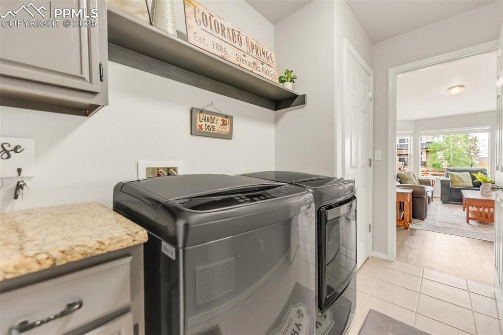 Nice laundry space off garage with great storage
