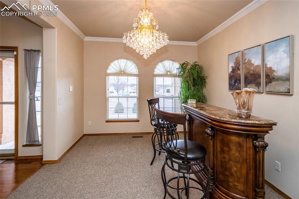 Dining room is big enough to accommodate a large dining table and a hutch. 