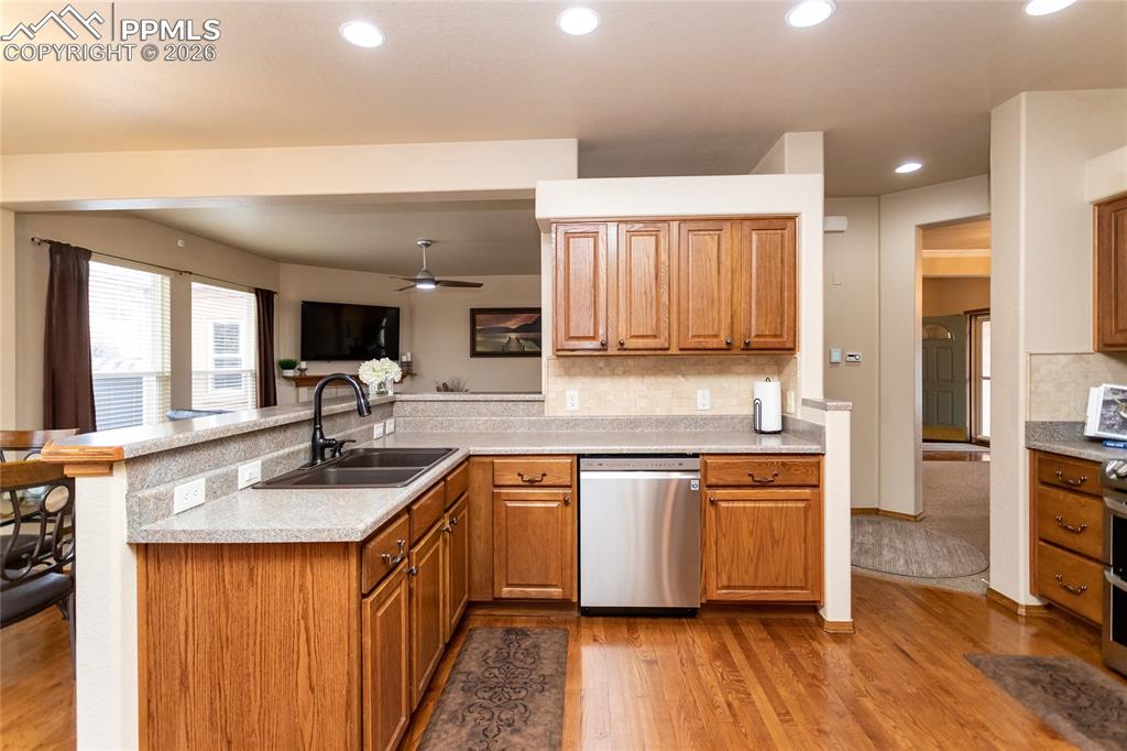 Kitchen features hardwood flooring.