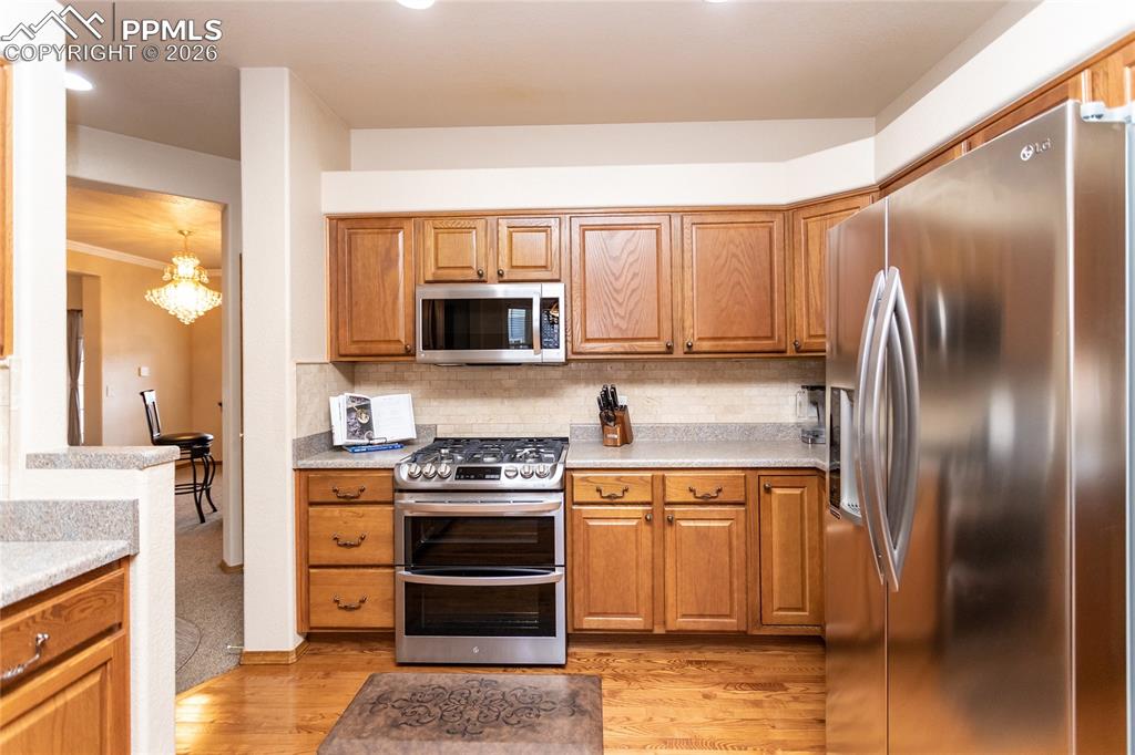 Another view of the kitchen; note the decorative ledges above the cabinets!