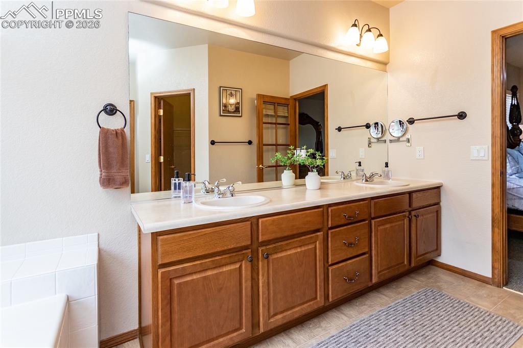 Extended vanity with double sinks offer lots of storage.