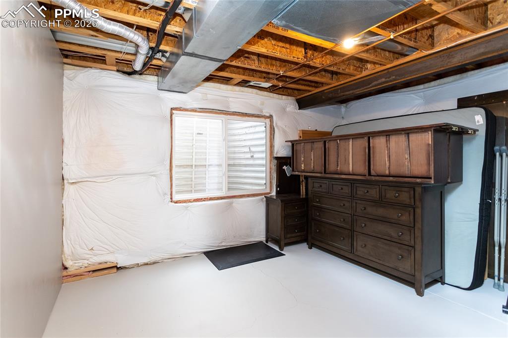 Unfinished 5th bedroom in the basement is currently used as storage.