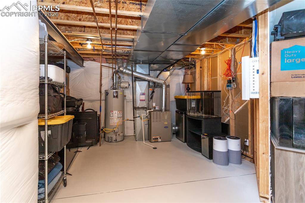 Utility room in the basement offers plenty of storage space.