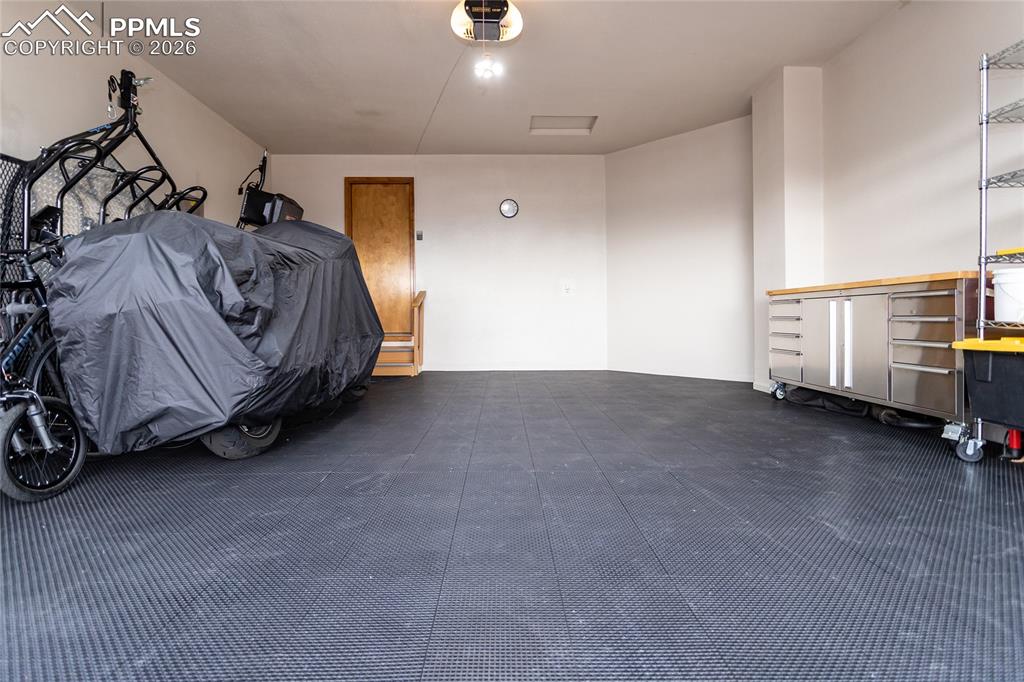 Garage features modular MotoFloor self drainage floor tiles!