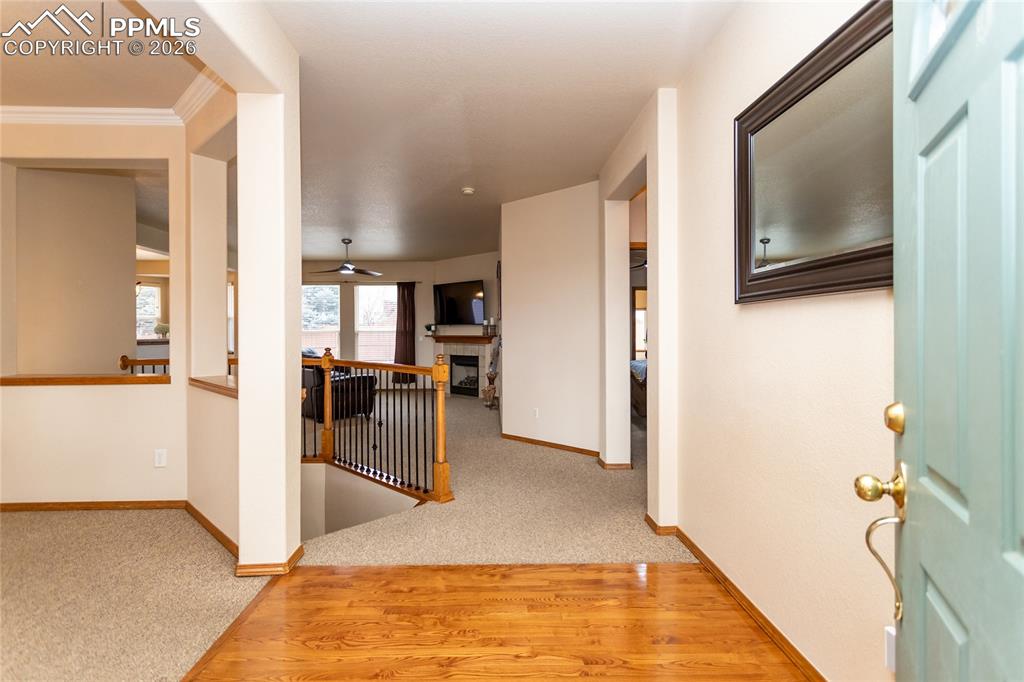 Large foyer with hardwood flooring.
