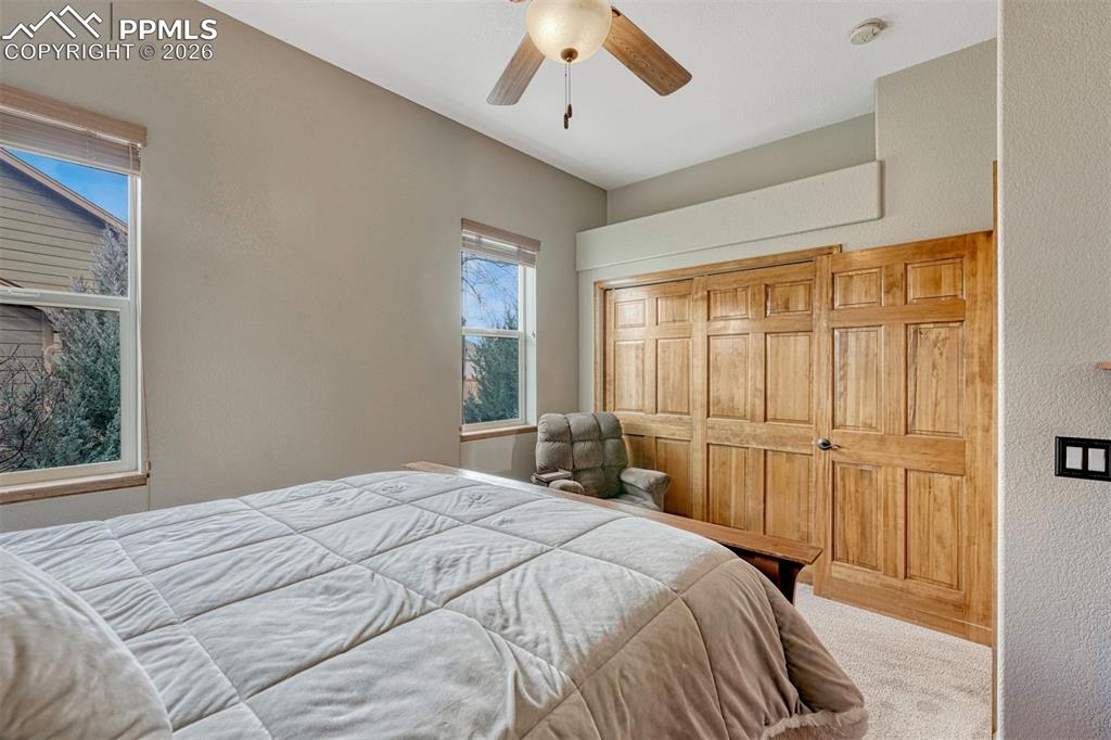 2nd main level bedroom. Carpeted bedroom with a nice  closet 