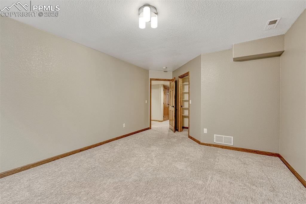 Other side of #1 basement bedroom with large walk-in closet.