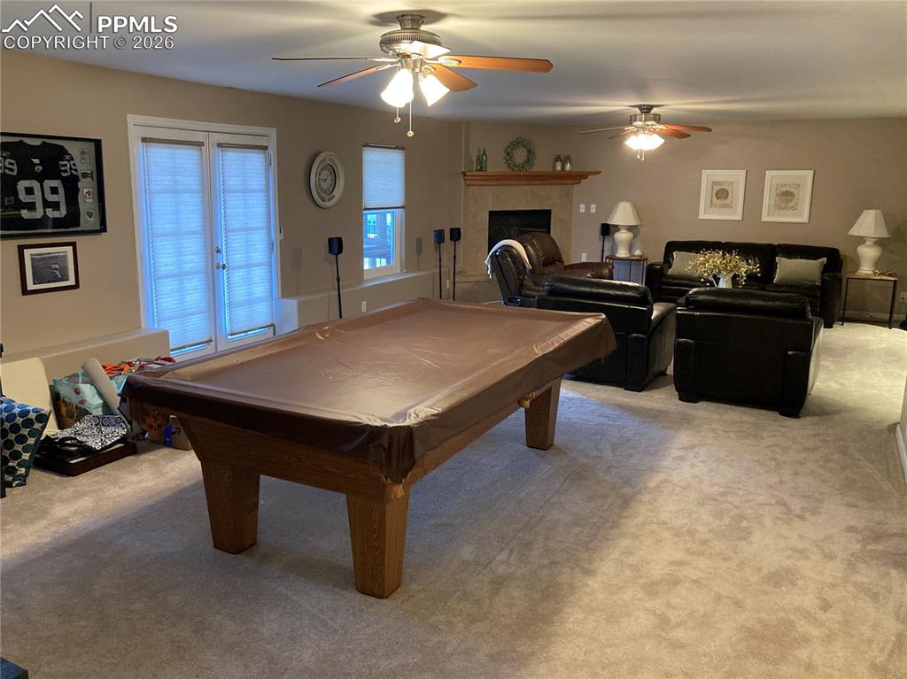 The large family room in the basement has lots of space for that pool table (which stays)!