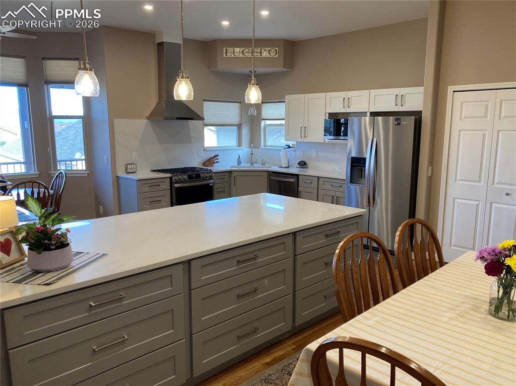 The kitchen features a gorgeous island with loads of storage, loads of storage,  brand new gas stove, frig, and large pantry!