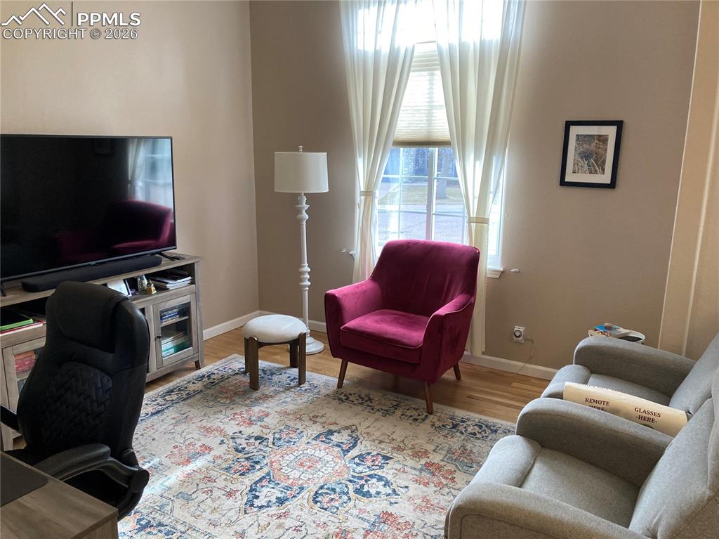 The two smaller bedrooms on the main level have been converted into one large room, perfect for a home office that could easily have two desks.