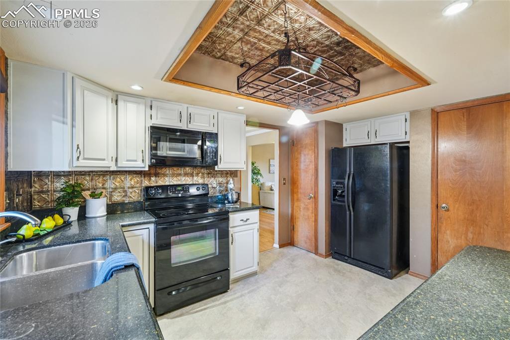 Pantry and door to basement are off the kitchen.