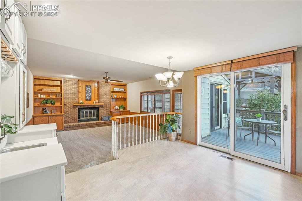 Eat-in kitchen area is between kitchen and den.