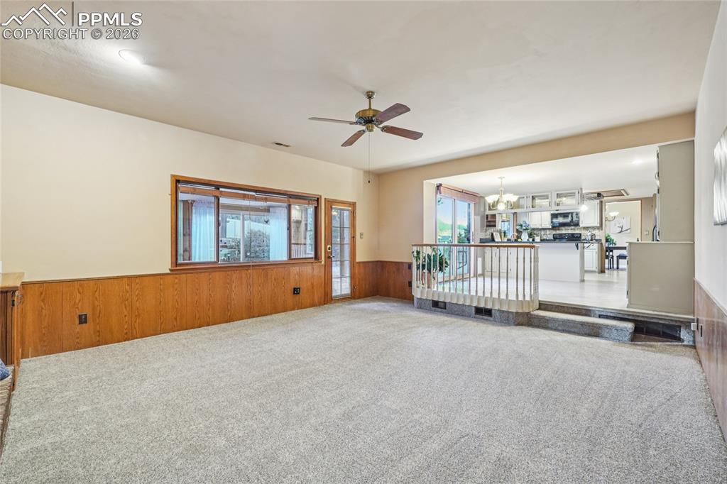 The den is off the kitchen and eat-in area.