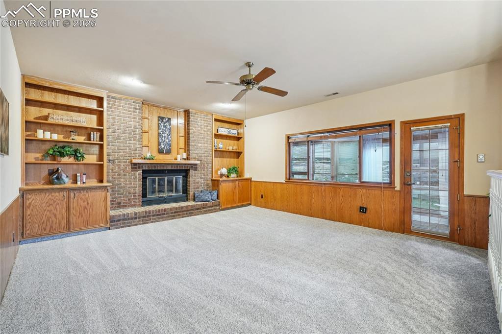 This large den is great for gathering around the fireplace.