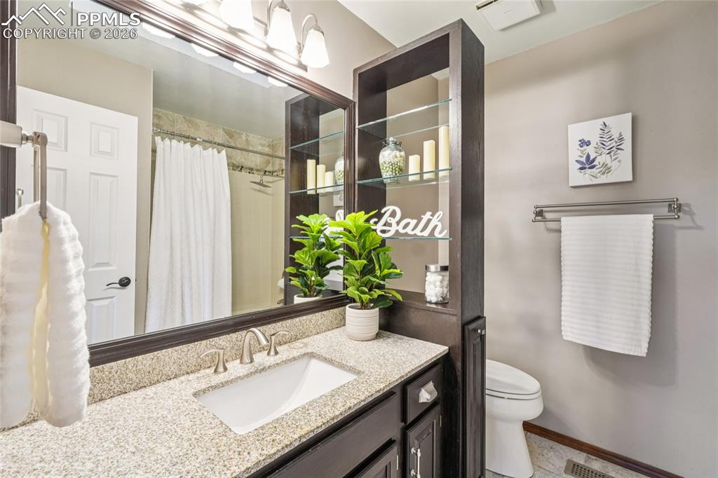 This secondary bathroom serves the three bedrooms upstairs that are outside the primary suite.