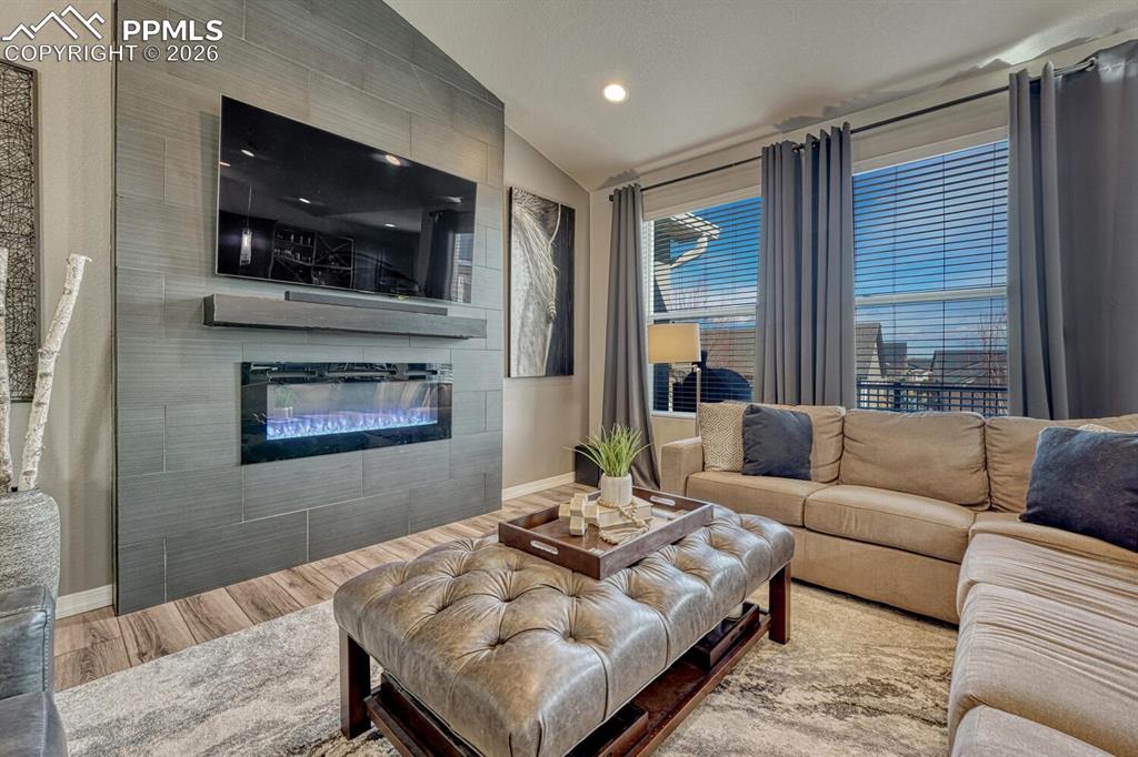 Custom electric fireplace with Italian tile surround to cozy up on chilly Colorado nights.