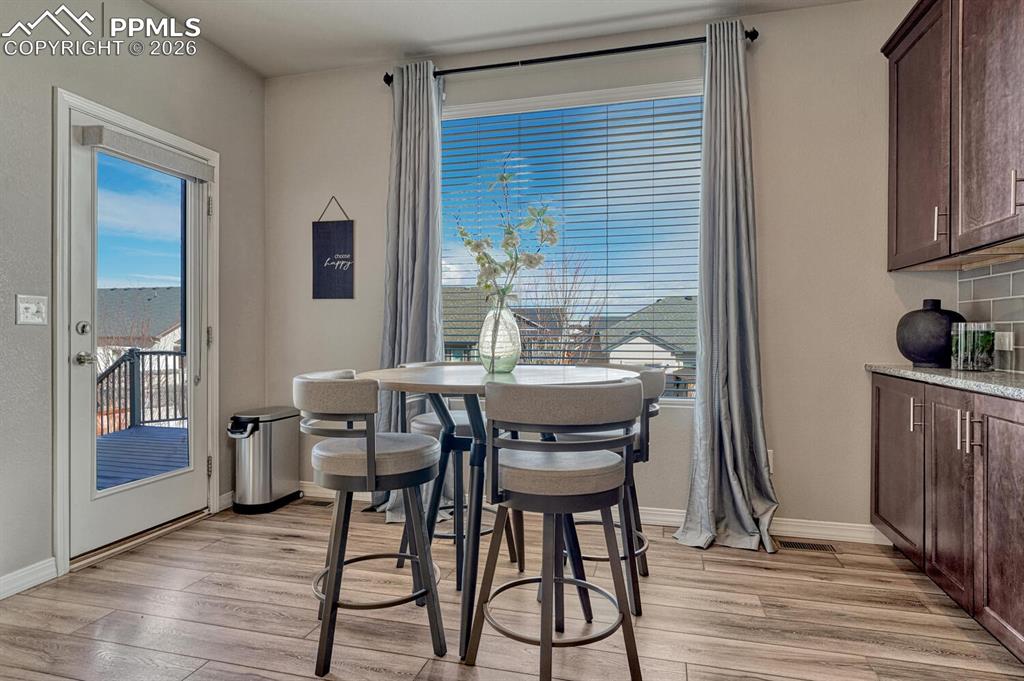 Walk out from the Dining Nook to the backyard composite deck.