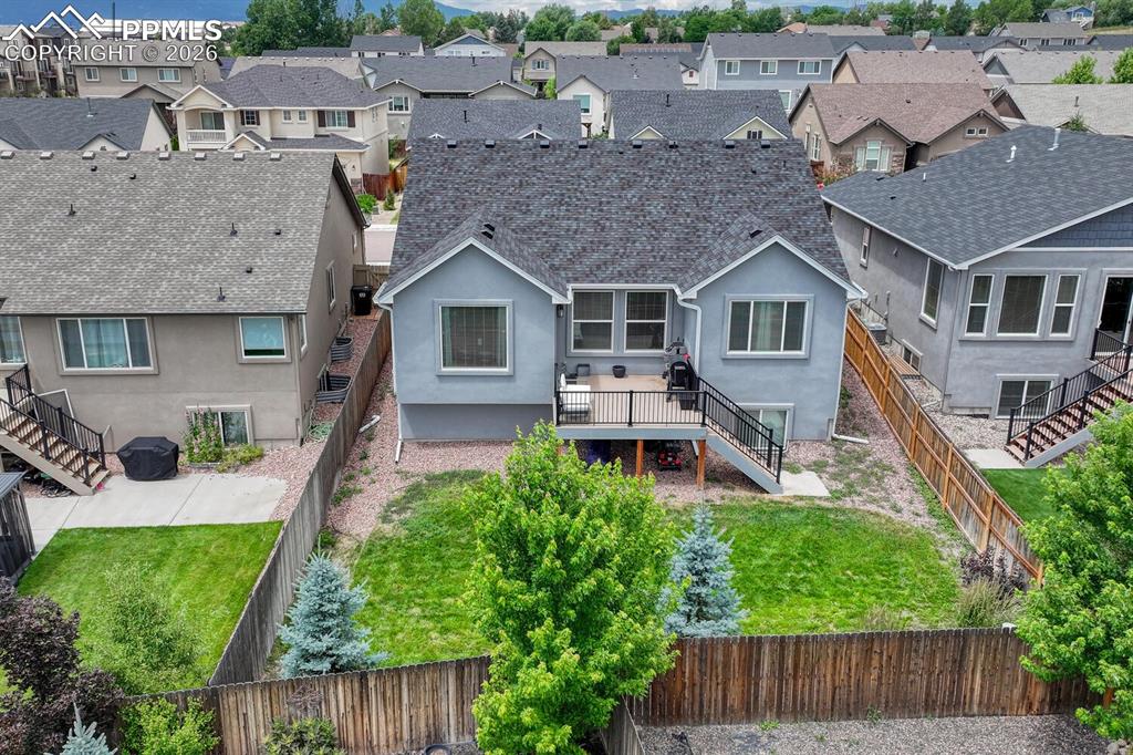 Aerial rear view of home and backyard.