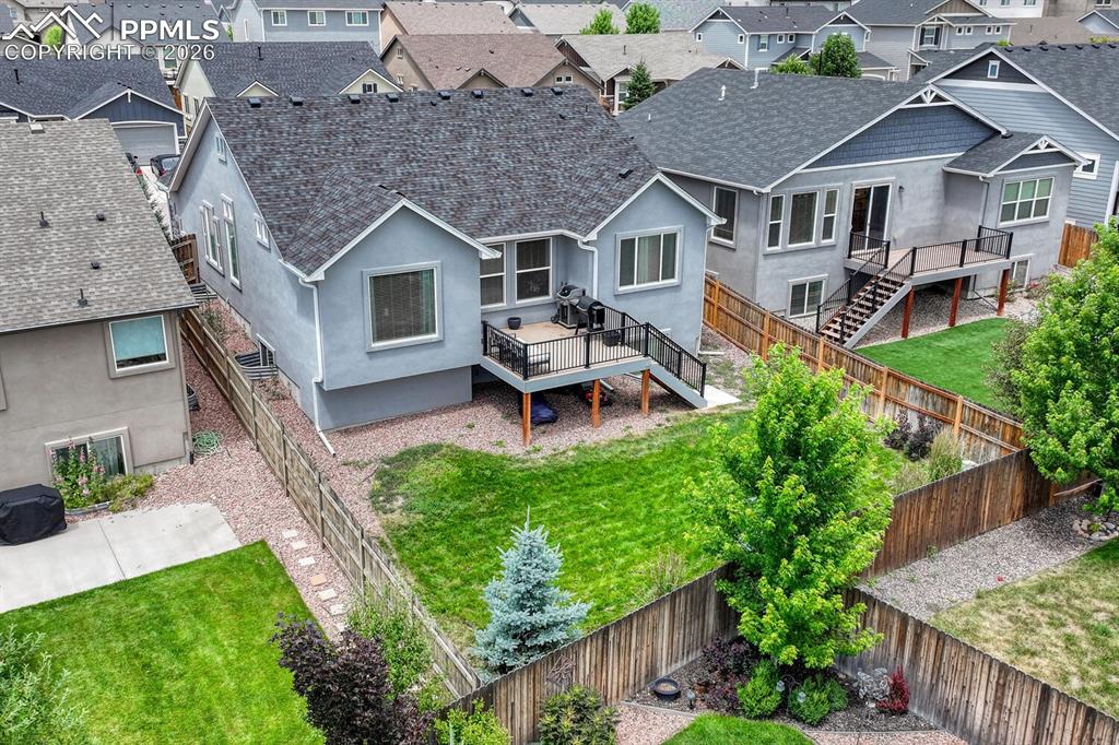 Aerial rear view of home and backyard.
