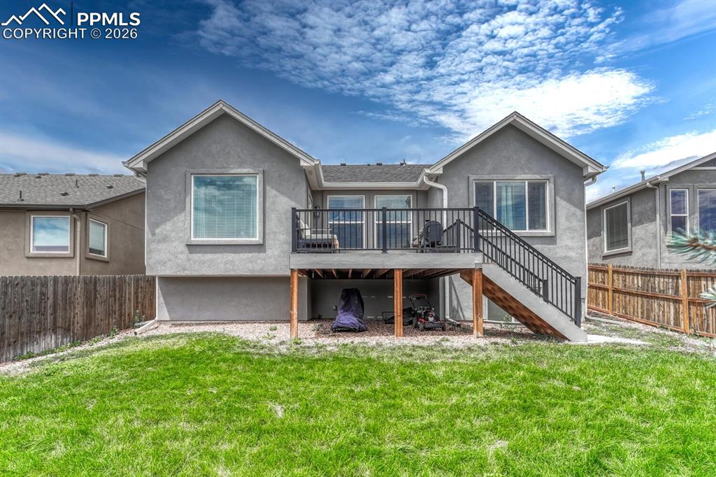 Fenced 0.13 acre lot with composite deck to enjoy the beautiful Peak views along with outdoor dining and relaxation.