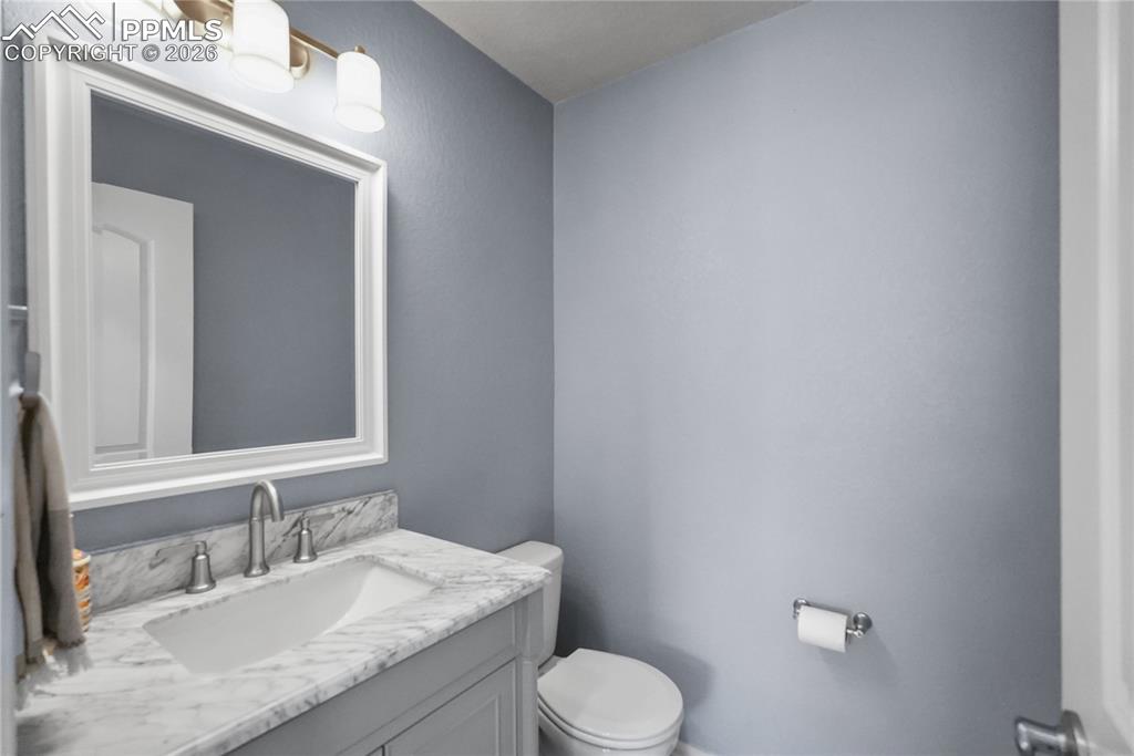 Hallway half bathroom.