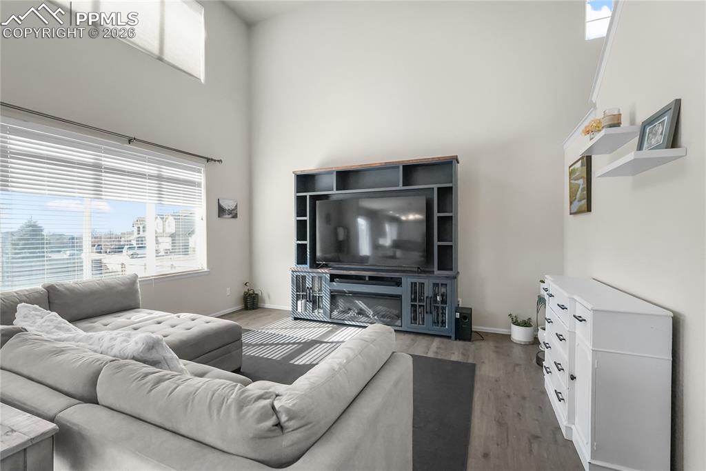 Living room with vaulted ceilings and natural light.