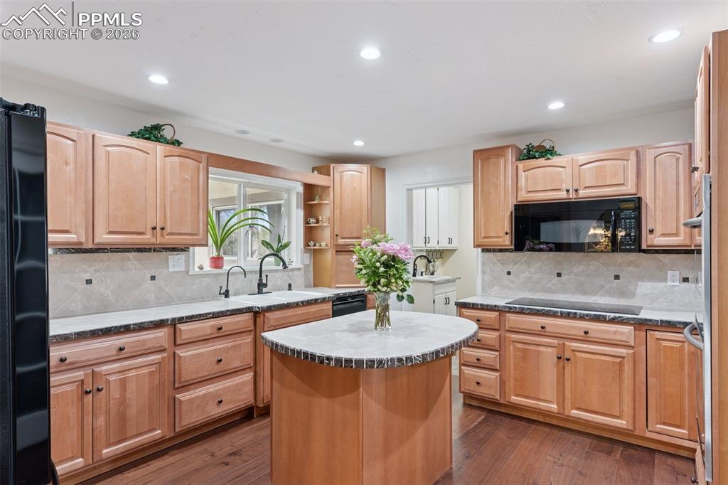 Kitchen before recent updates (not pictured: double ovens and large pantry & Updates: stone/quartzite Taj Mahal countertops w/marble backsplash)