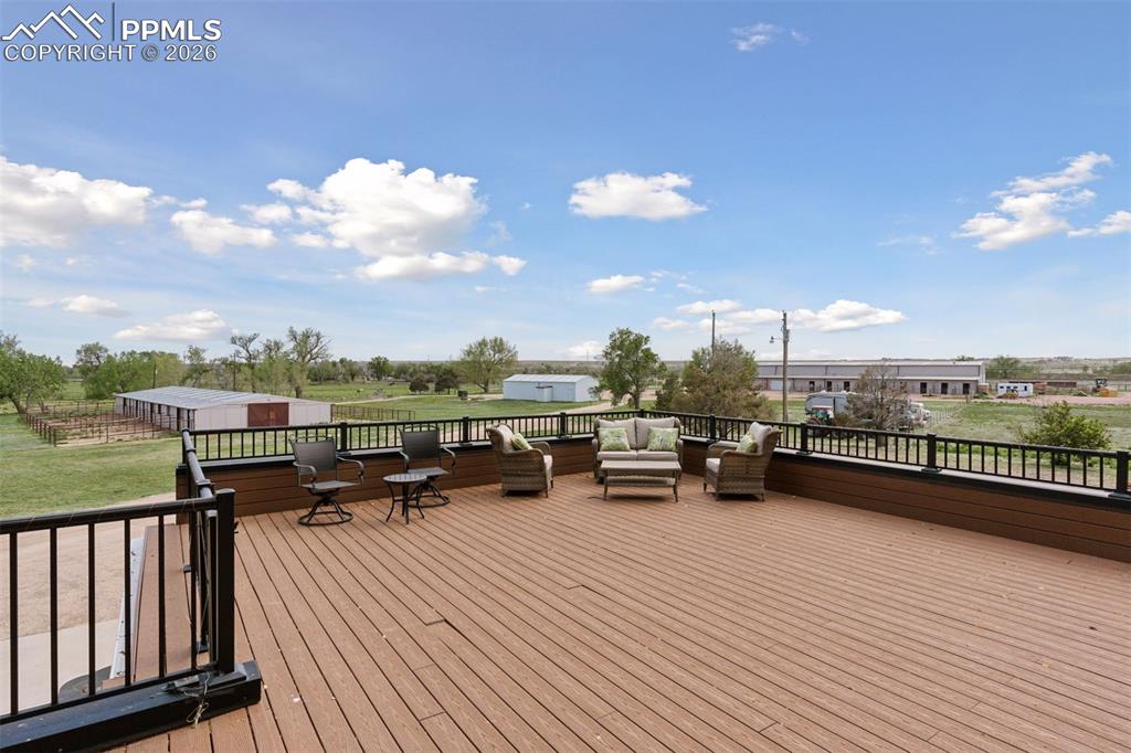 Low maintenance deck off of Primary Suite overlooking facilities(not pictured: hot tub & mountain views