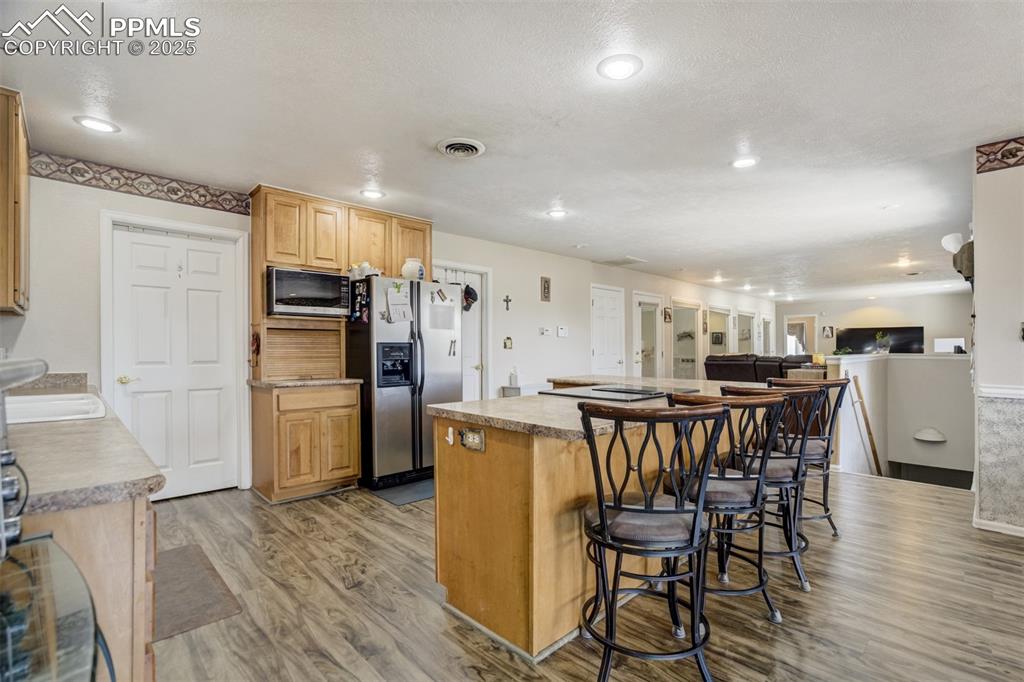 Kitchen with a breakfast bar, and island in an open floor plan