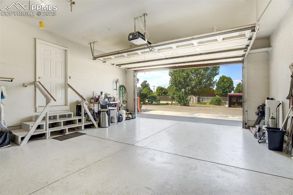 Garage featuring a garage door opener