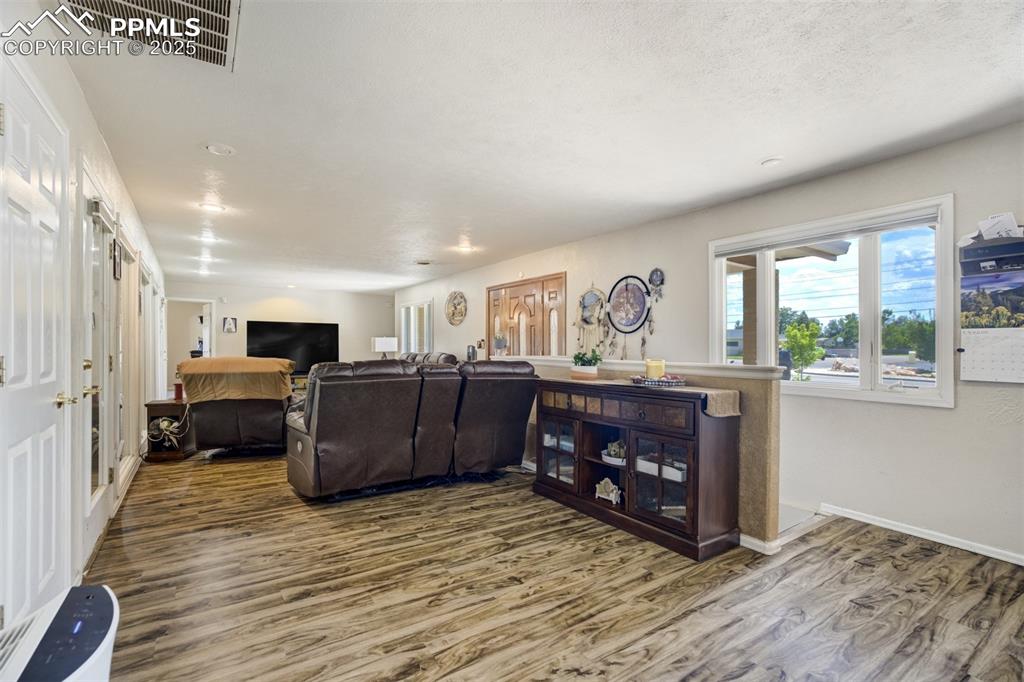 Living room with wood finished floors and baseboards