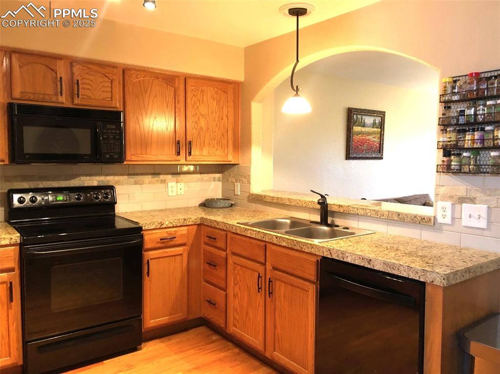 Arched opening to bar seating and living room