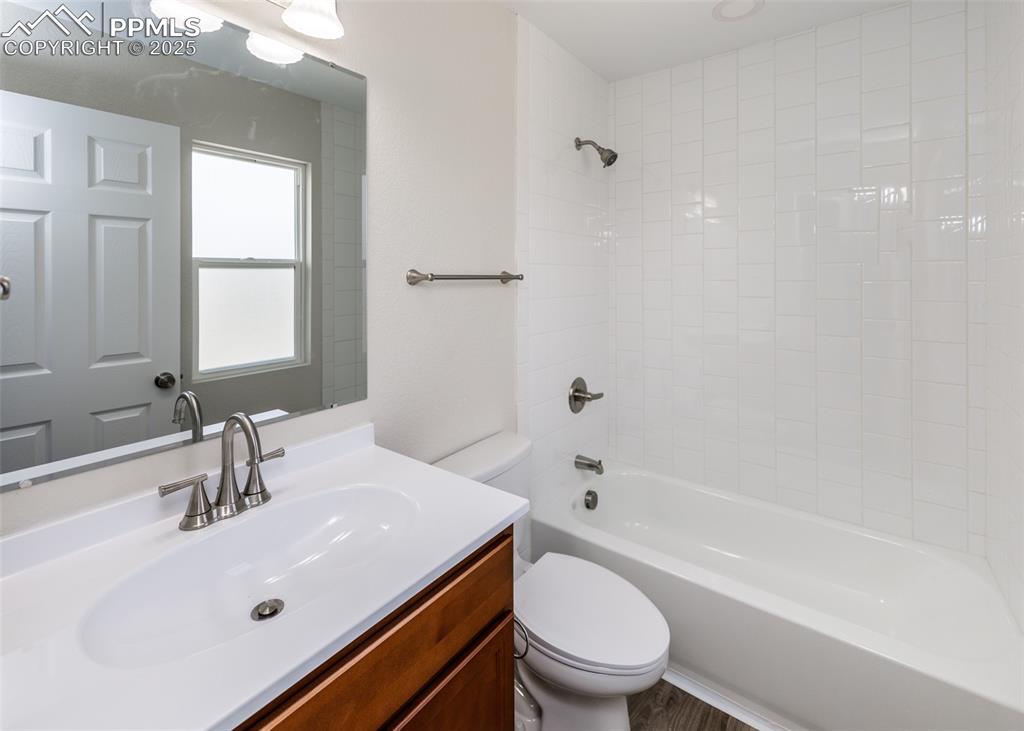 Bathroom with tub / shower combination and vanity