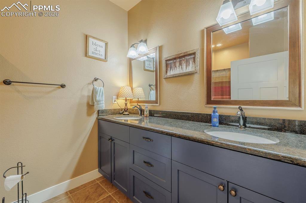 Bathroom serving main level guest bedrooms. 