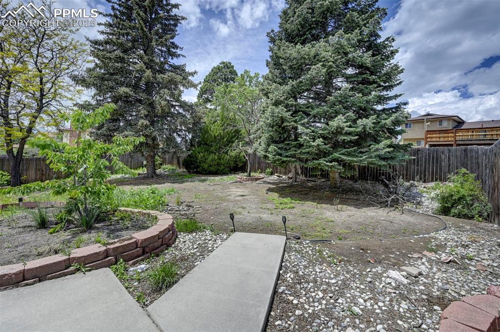 View of fenced backyard