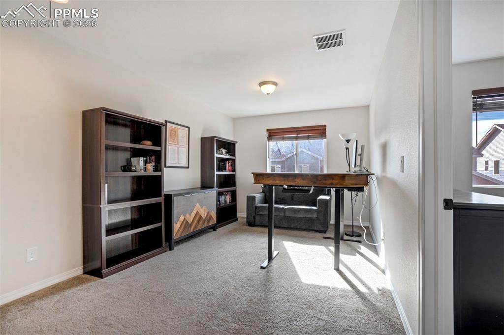 Light filled flexible loft space, currently used as an office/studio, could be a family room or a workout room.  Could be finished to create a 3rd bedroom if needed. Carpet.