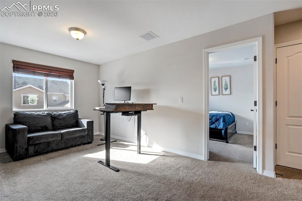 Light filled flexible Loft space.  Door to the second bedroom.