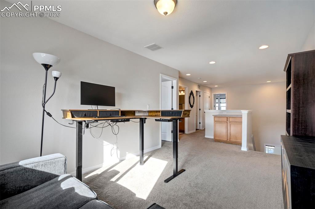 Light filled flexible use loft area, currently used as office/studio.  