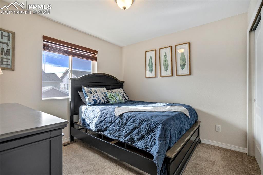 Light filled second bedroom, with large closet.