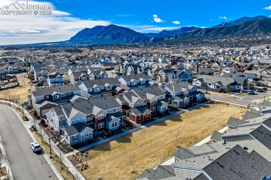 Aerial view of residential area featuring a mountain backdrop