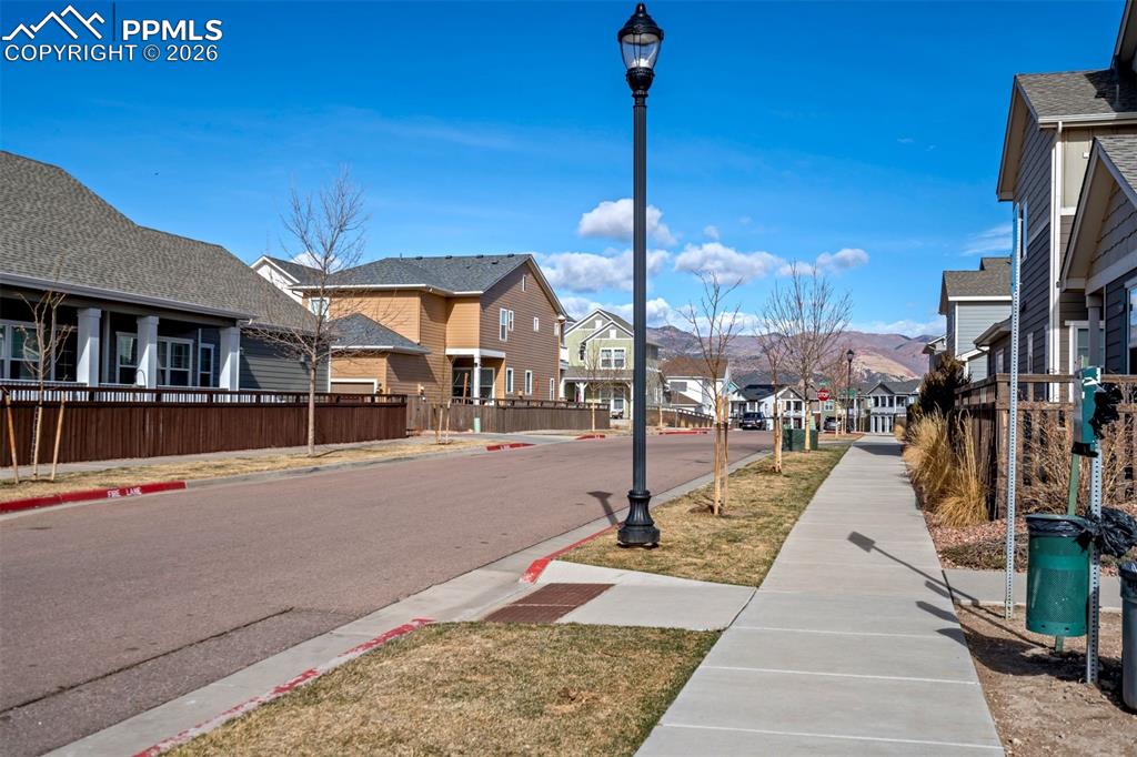 Showing the sidewalks, lights and mountain views in this walkable community.