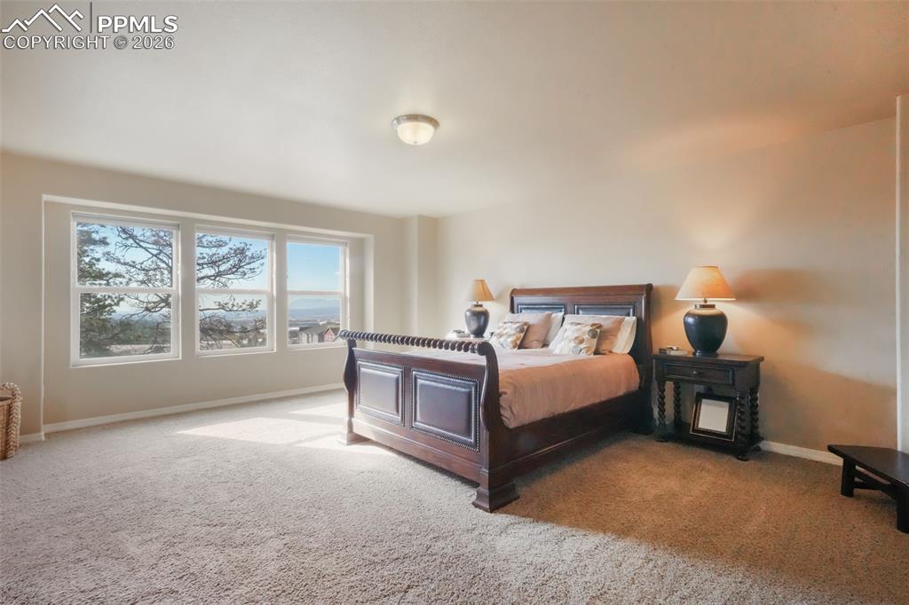 Upstairs primary bedroom with mountain views, 5 piece ensuite bathroom and large walk in closet