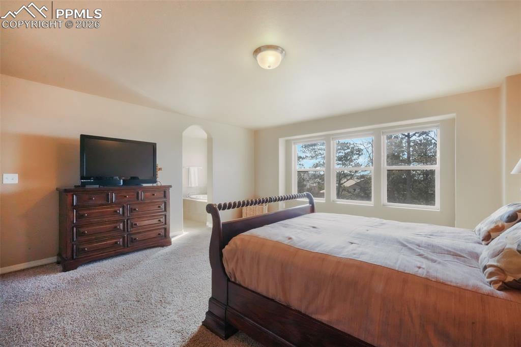 Upstairs primary bedroom with mountain views, 5 piece ensuite bathroom and large walk in closet